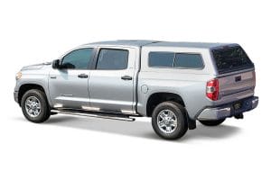 Silver toyota tundra with a Jason truck cap